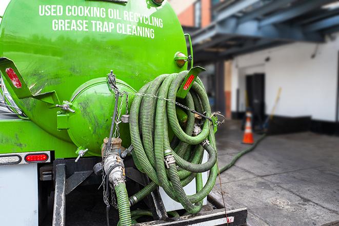 commercial kitchen grease trap being pumped out in Clarksburg, MD